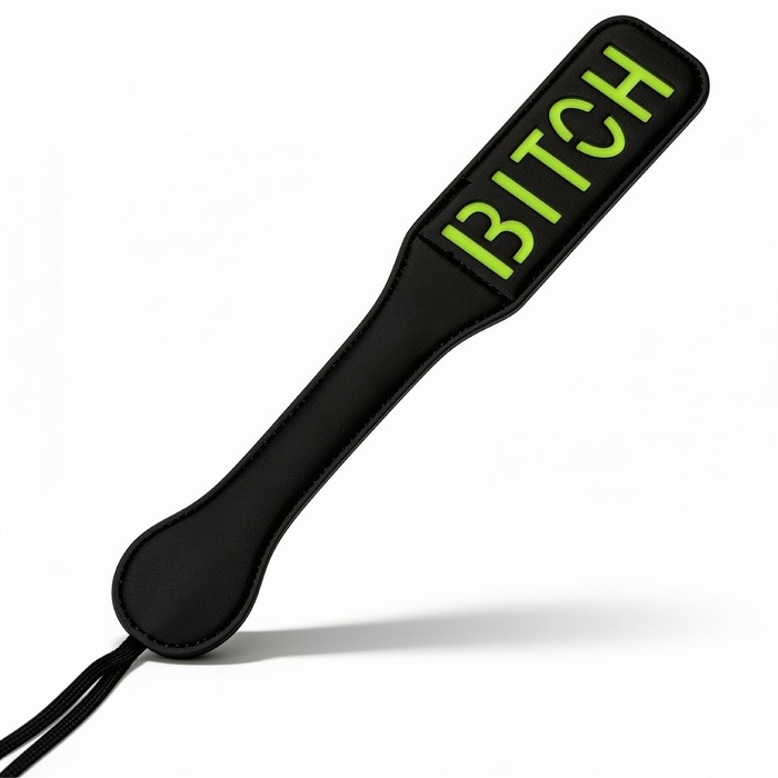 Паддл DS Fetish з люмінісцентним надписом 'Bitch', чорний